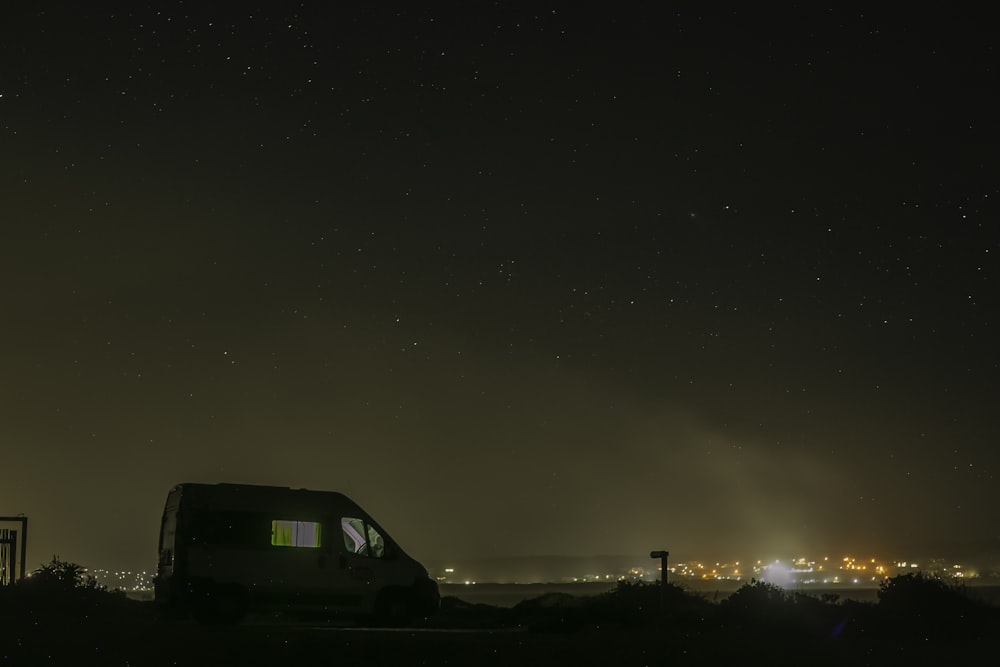 a car parked in a parking lot at night