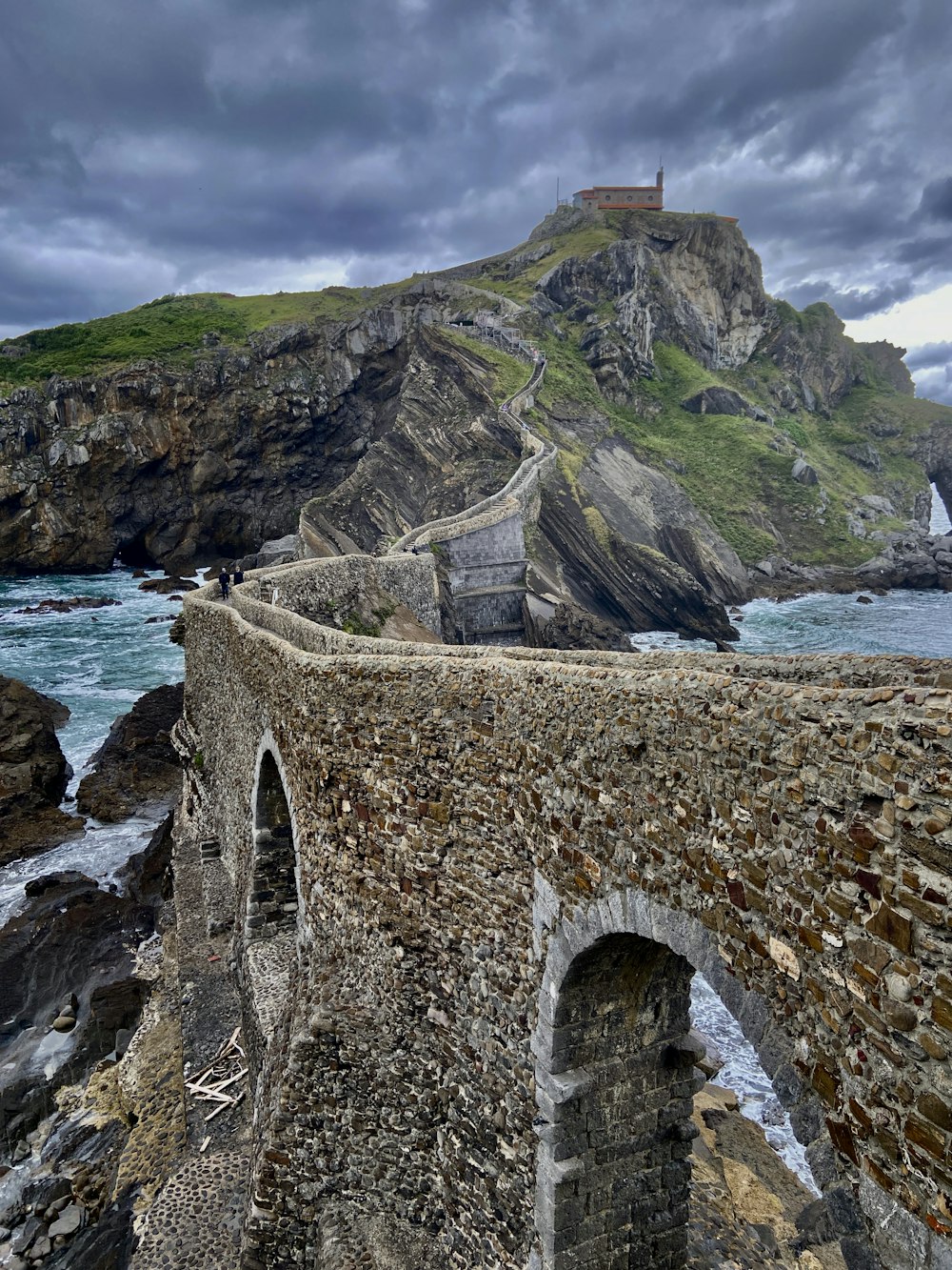 a stone bridge over a body of water