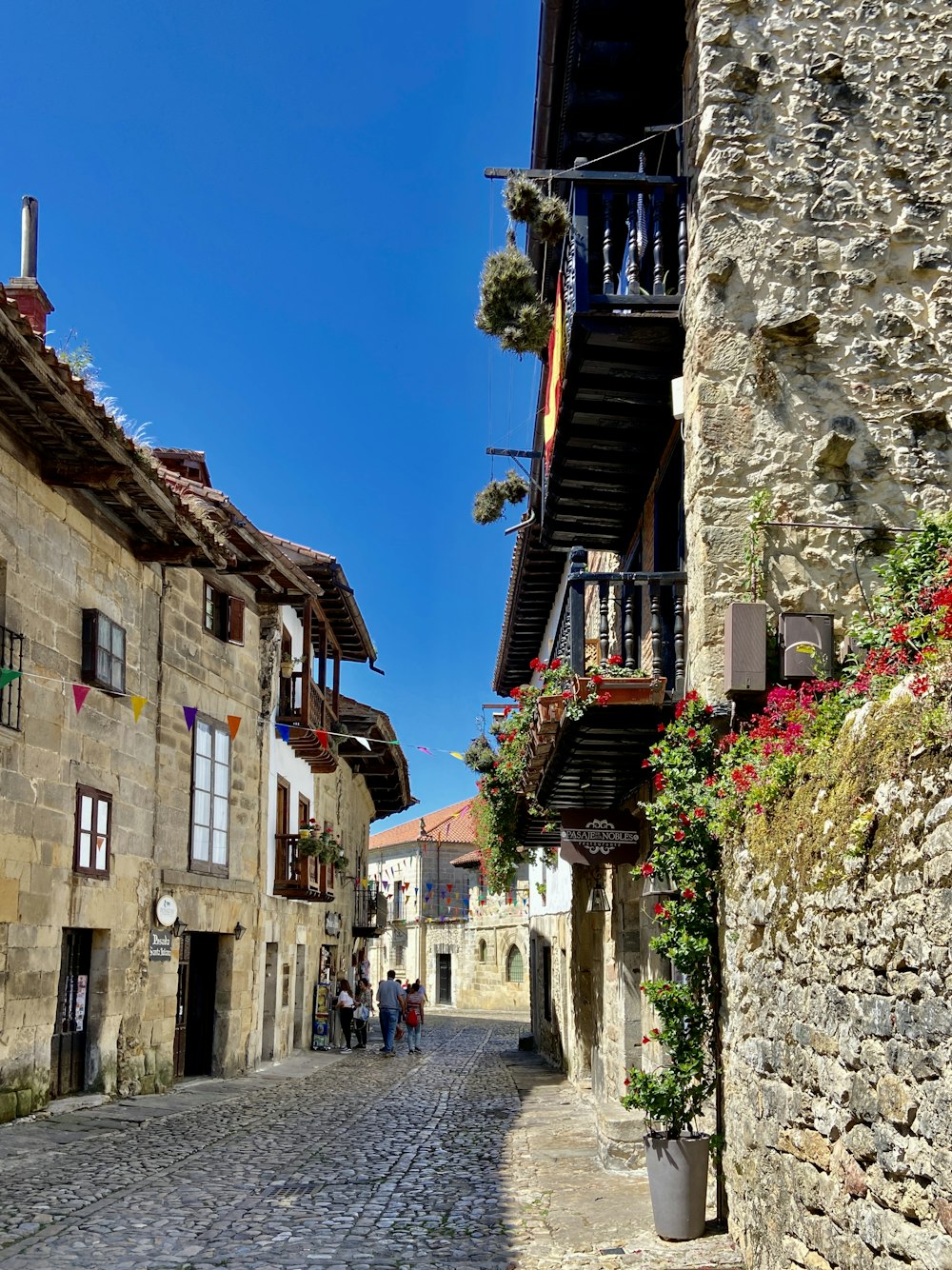 a street with buildings and people