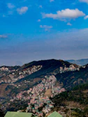 A picturesque hill station with misty mountains.