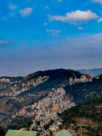 A scenic view of a peaceful hill station with travelers enjoying the serene landscape.