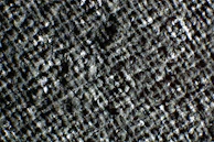 Close-up of textured epoxy surface with a subtle metallic shimmer under bright lighting.