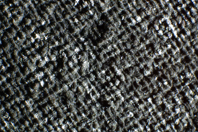 Premium materials detail shot showing glassmorphism effects and polished metal textures.