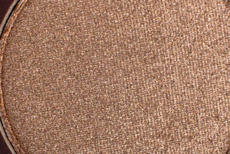 Close-up of fine copper powder with a rich reddish hue.