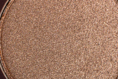 Close-up of fine copper powder with a rich reddish hue.