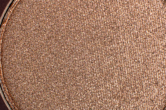 Close-up image of shimmering nano powder particles under a microscope.