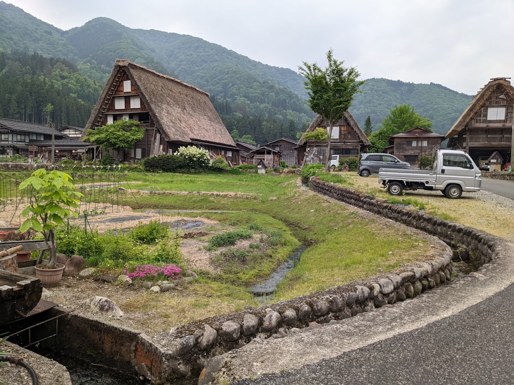 a small village with a truck parked in the middle