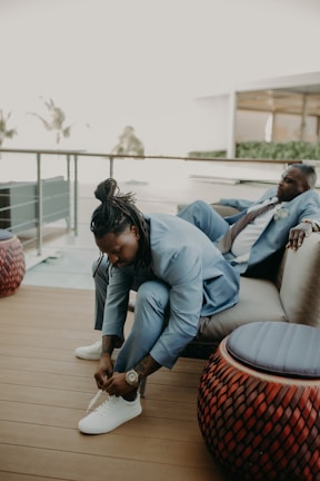 A casual setting with men wearing stylish shoes outdoors.