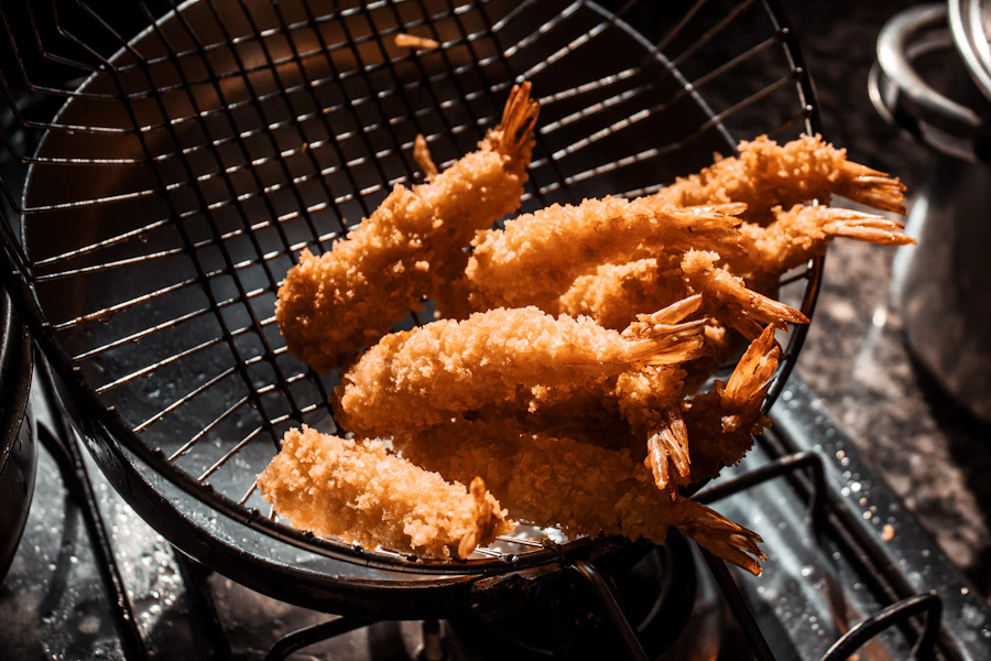 Air fryer cooking crispy golden food quickly in a modern kitchen