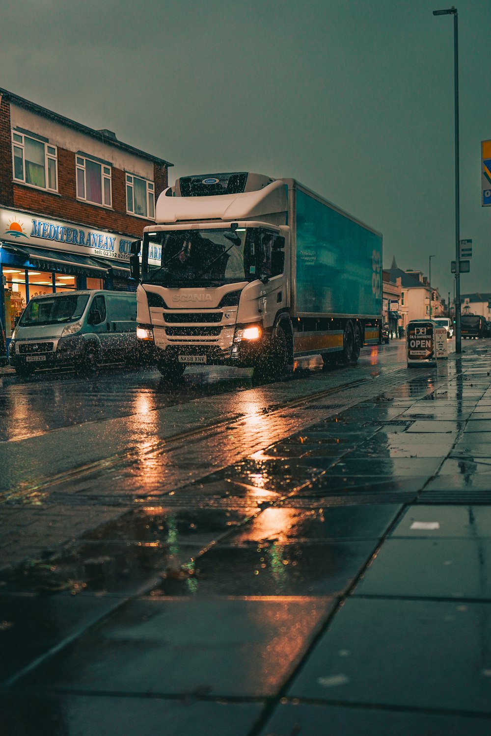a truck on a wet street