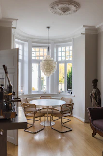 a dining room with a chandelier and a table