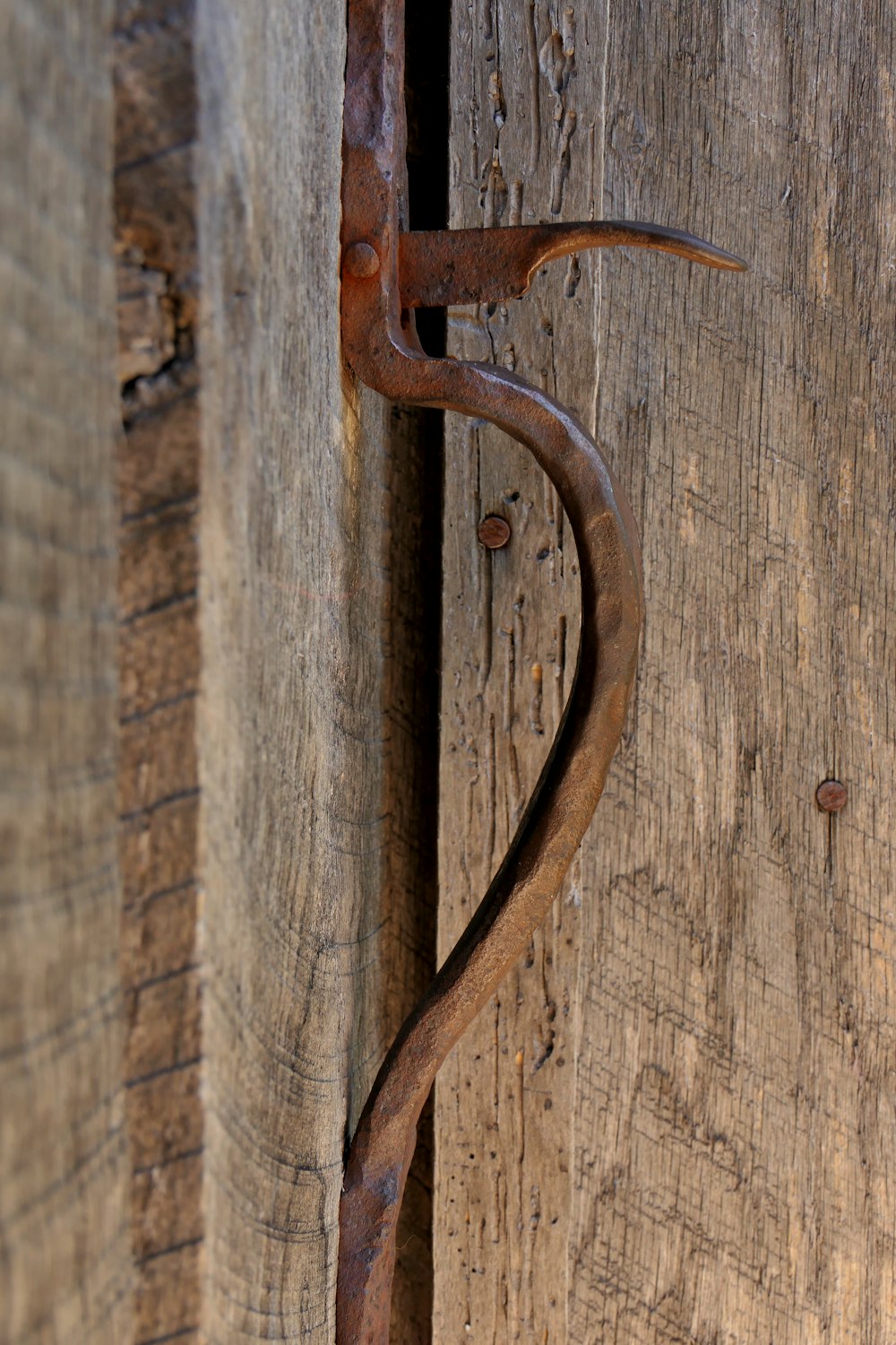 a door handle on a wooden wall