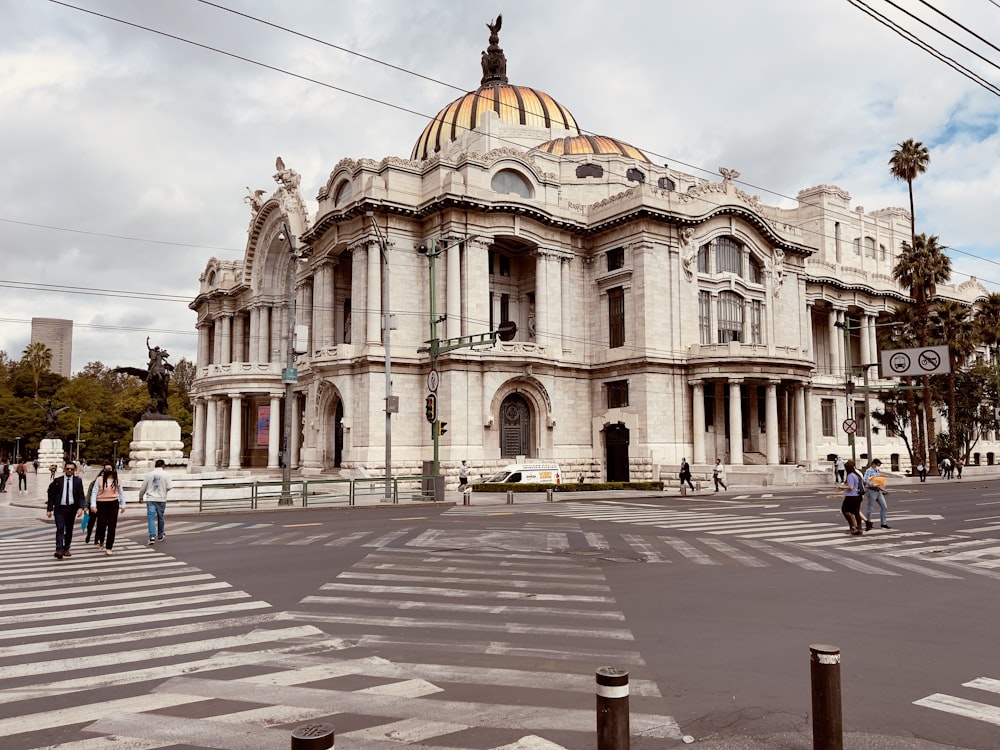 a large building with a dome roof with Palacio de Bellas Artes in the background