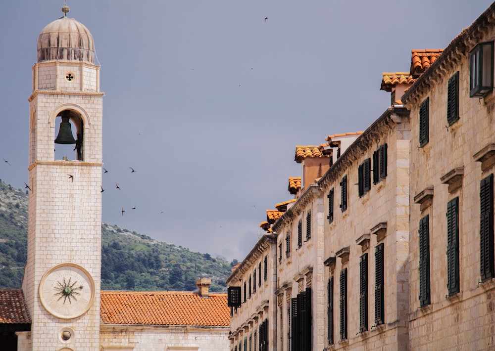 a clock tower next to a building