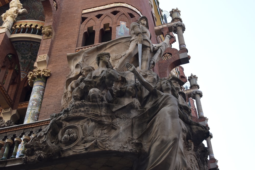 a large stone building with statues