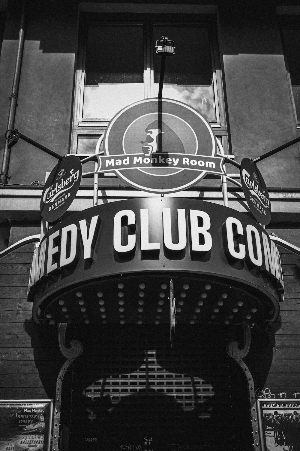 a black and white photo of a sign on a building