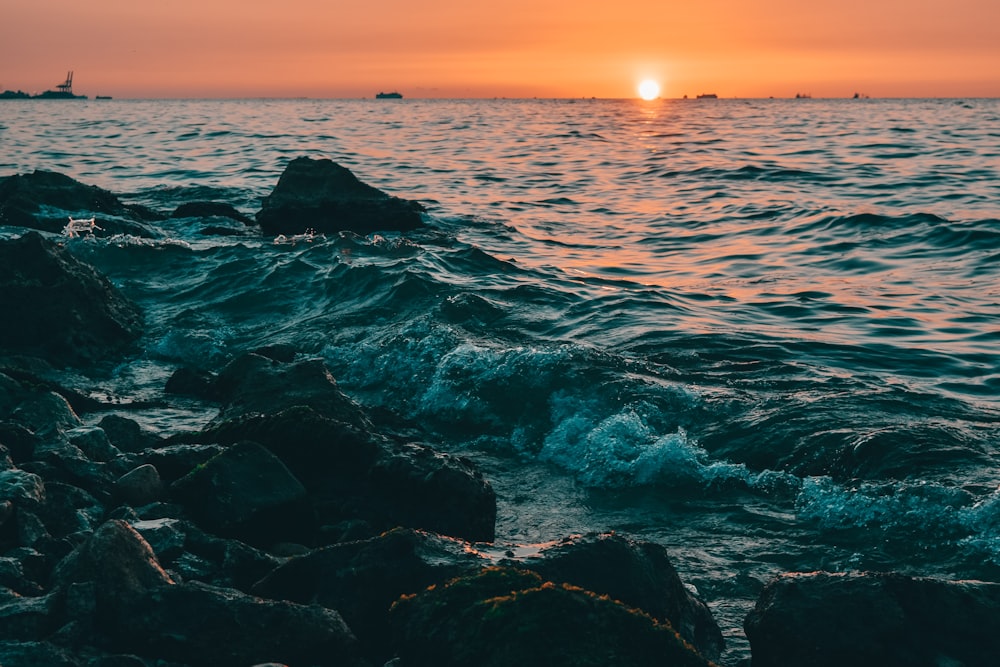 a rocky beach with waves crashing