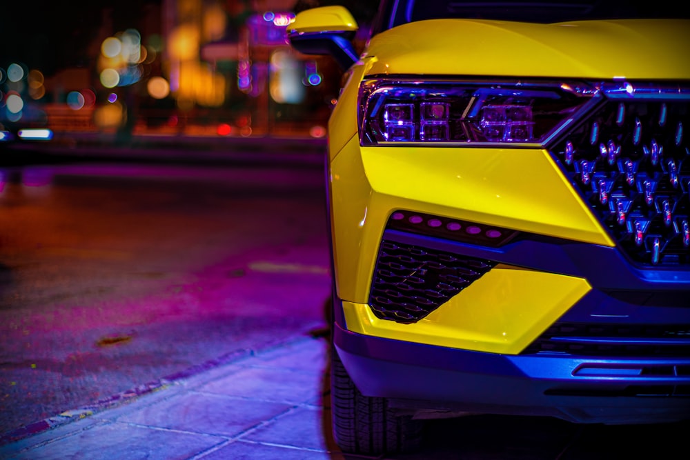 a yellow car on a street