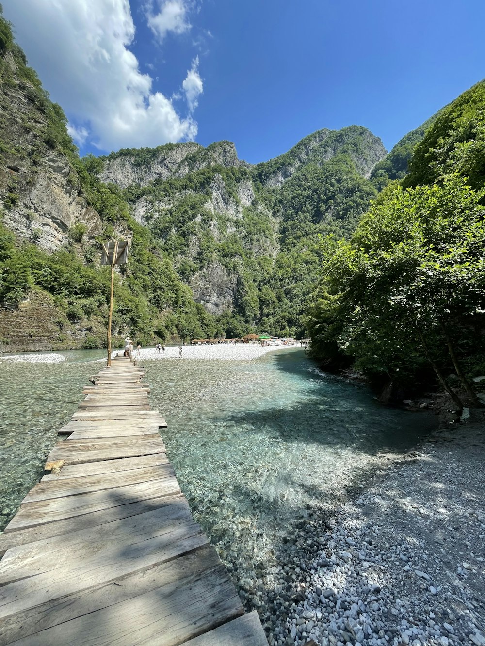 a wooden walkway over a river