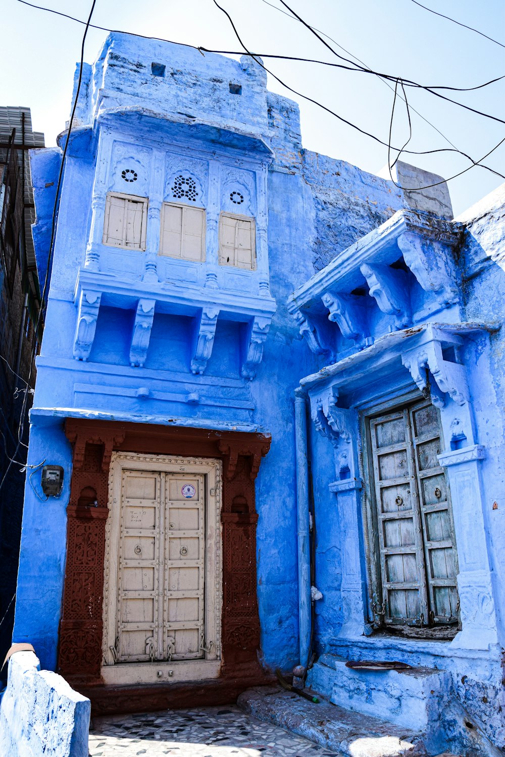 a blue house with a white door