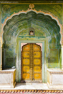 Close-up of a beautifully finished doorway featuring dark trim and green decorative elements in a residential project.