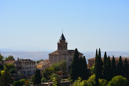 A serene image of the Live Oak AME Church surrounded by lush greenery.
