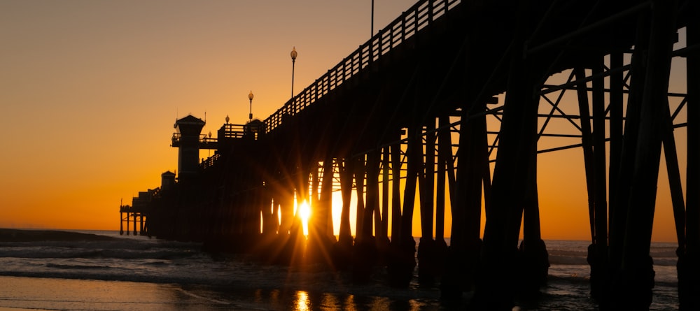 a large bridge with a sunset