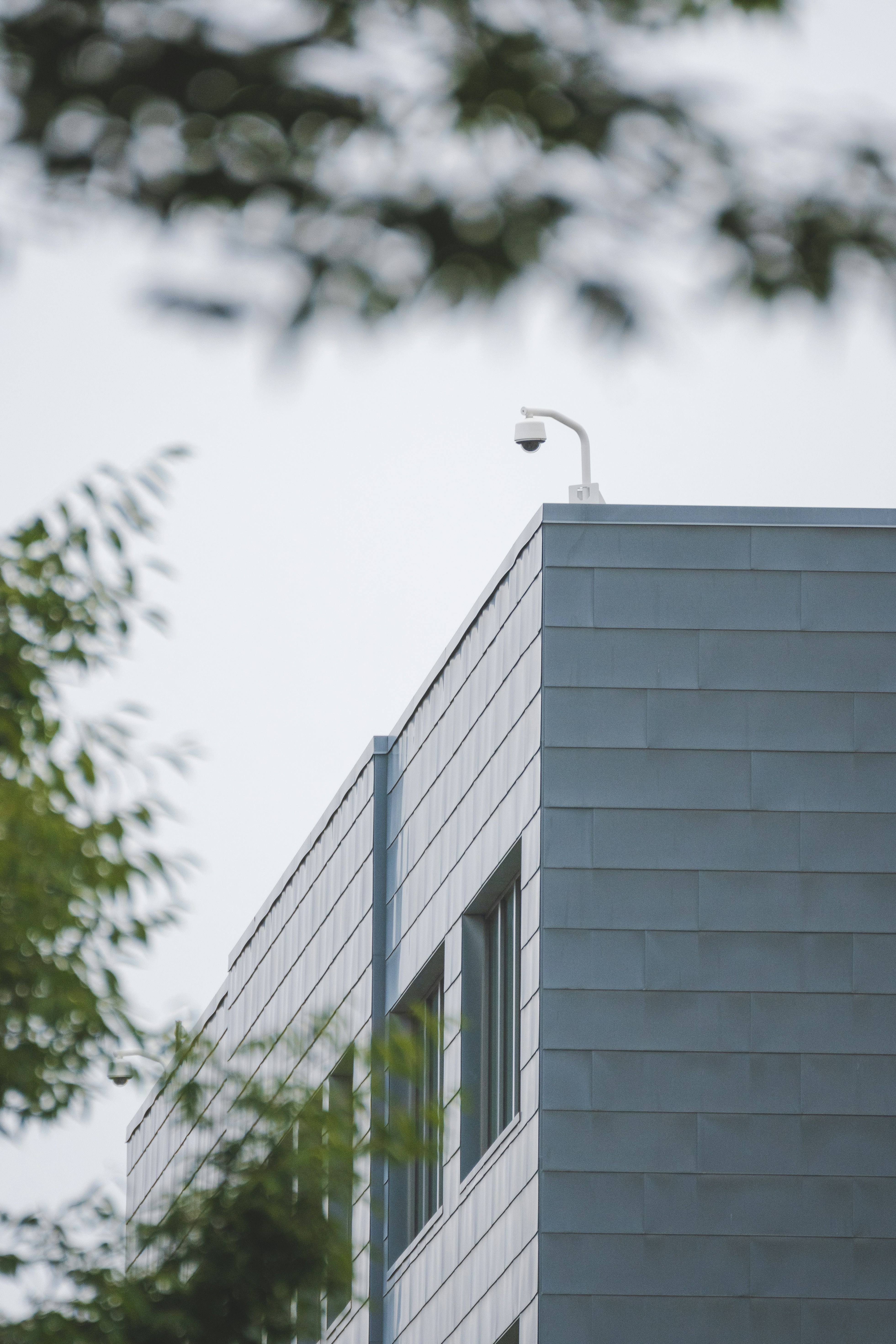Security camera mounted on a modern commercial building