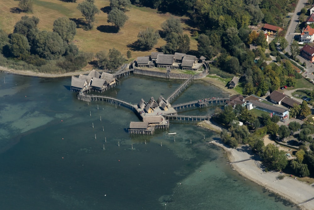 a body of water with buildings and trees around it