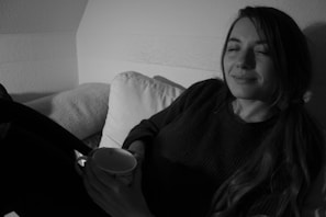 A cozy, inviting scene with a person enjoying a relaxed moment with their favorite product.