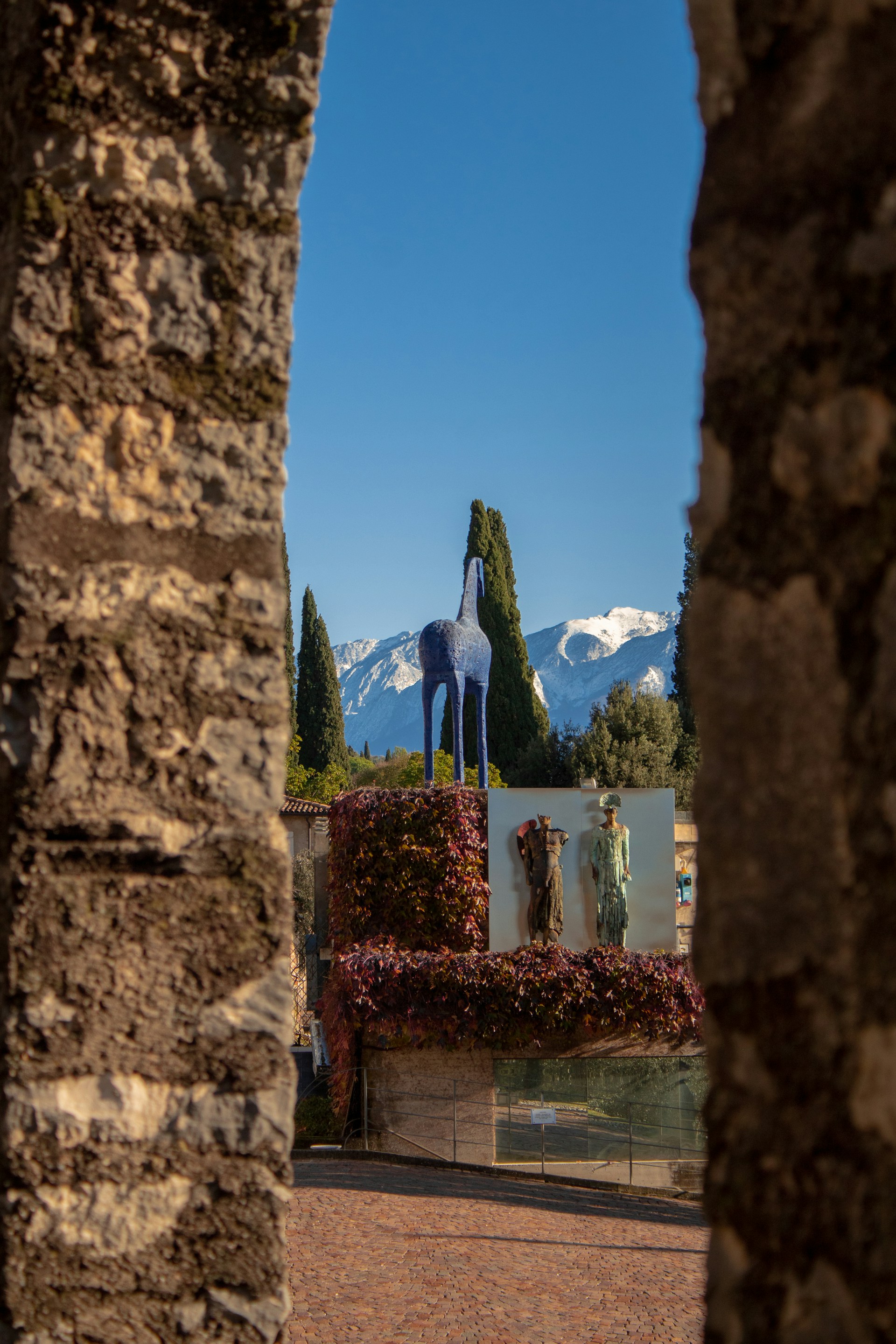 a stone wall with a painting on it