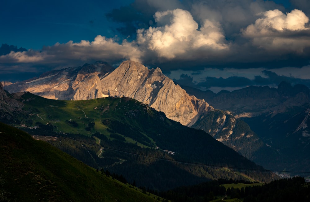 a mountain range with clouds