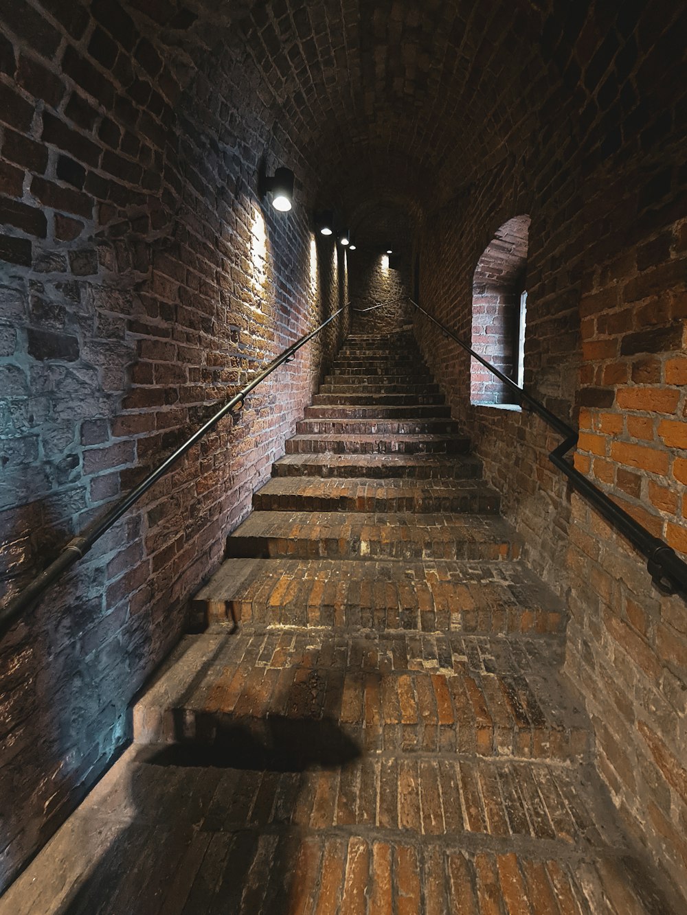 a brick staircase in a brick building
