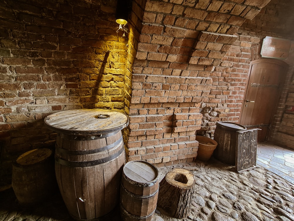 a brick wall with barrels