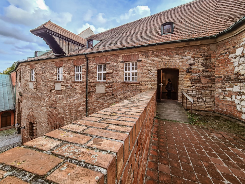 a brick building with a brick walkway