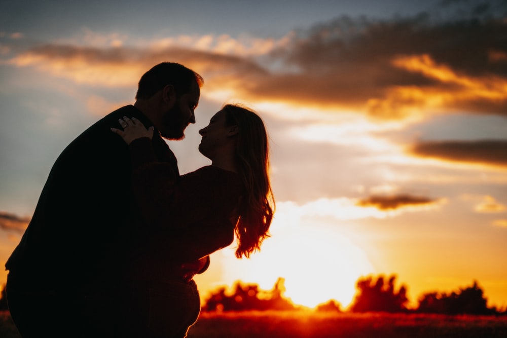 a man and woman kissing