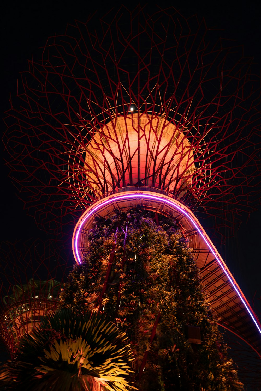 a tall tower with lights at night