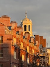 Historic campus building bathed in warm sunlight, symbolizing CIBC’s rich heritage.