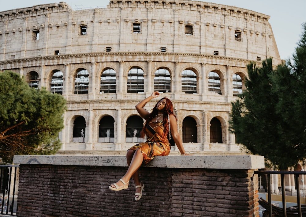 a person jumping on a brick wall