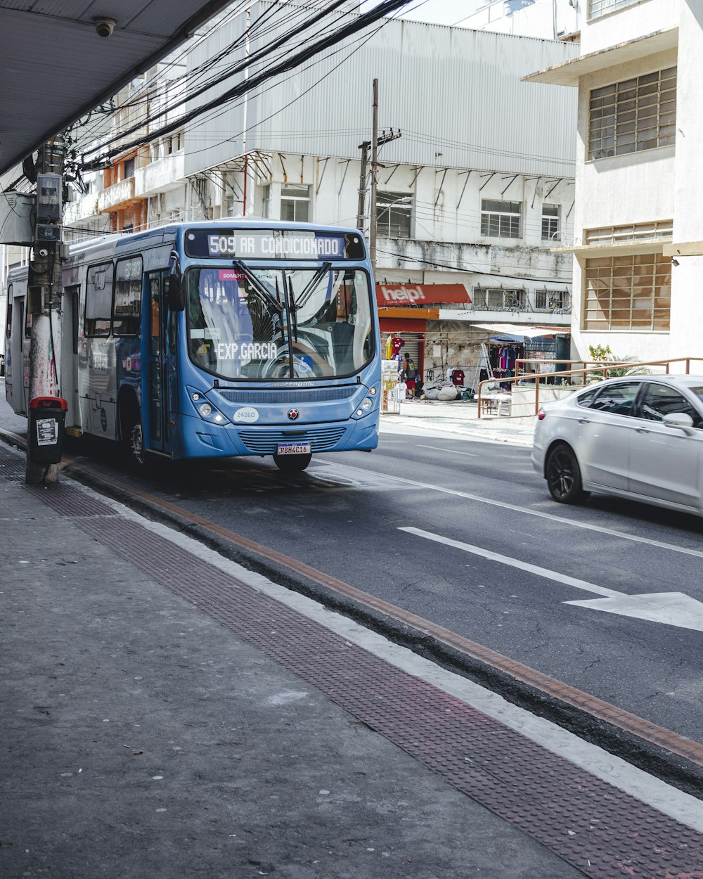 a blue bus on the street