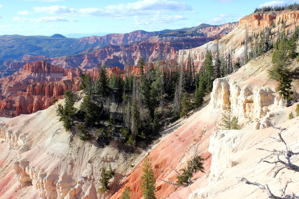 a rocky and snowy mountain with Bryce Canyon National Park in the background