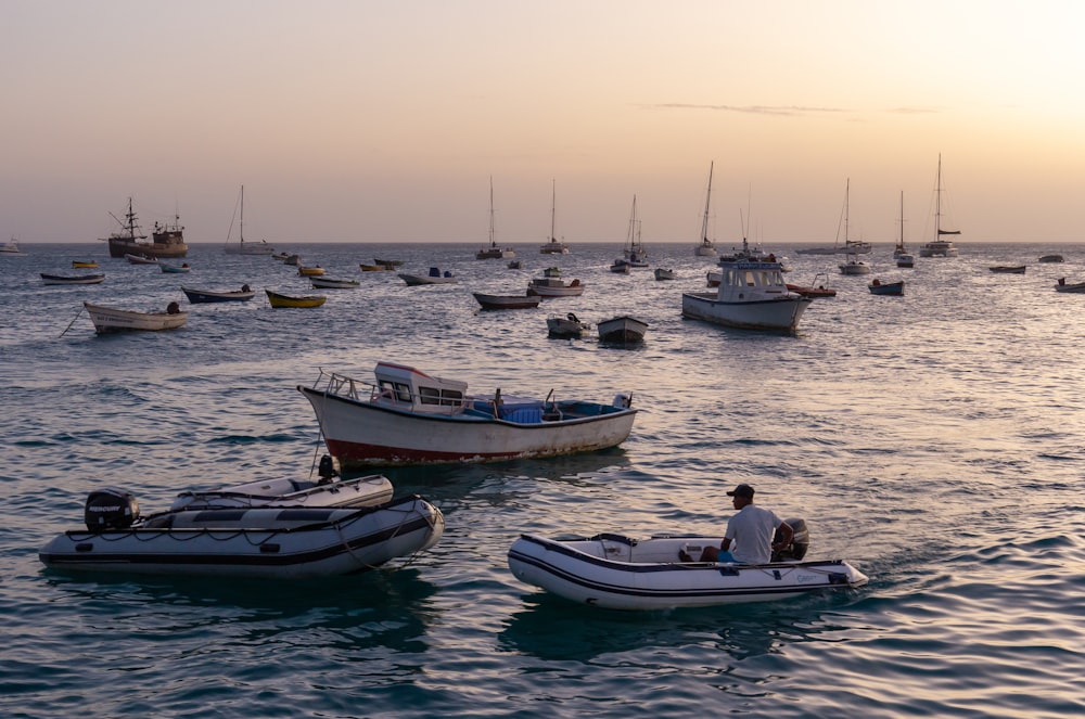 a group of boats sit in the water