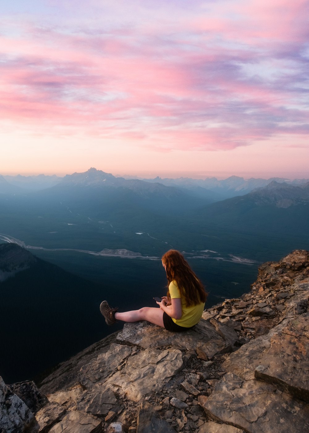 a man sitting on a rock