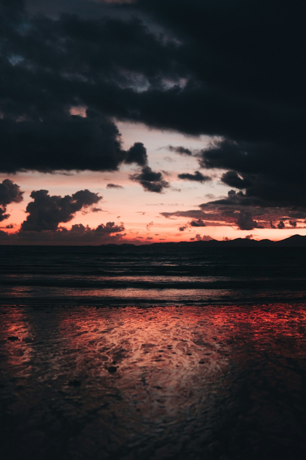 a sunset over a beach