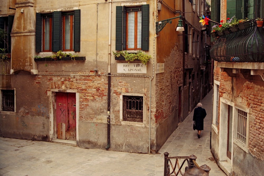 a person walking down a sidewalk