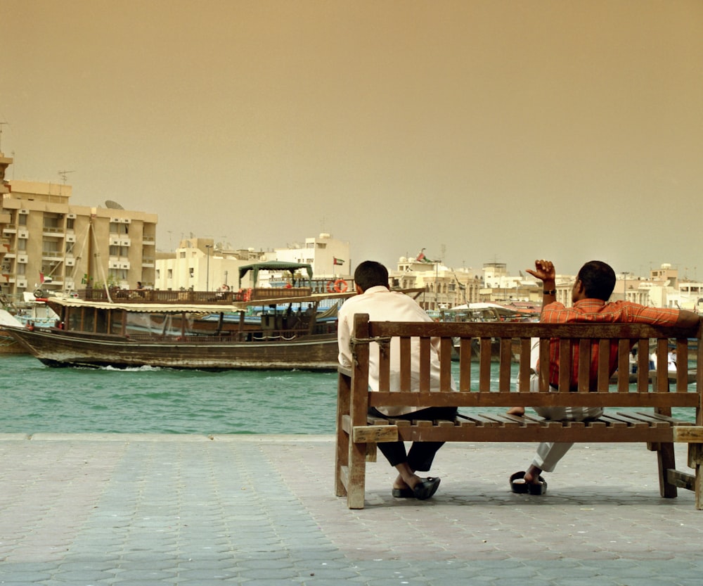 a couple sitting on a bench