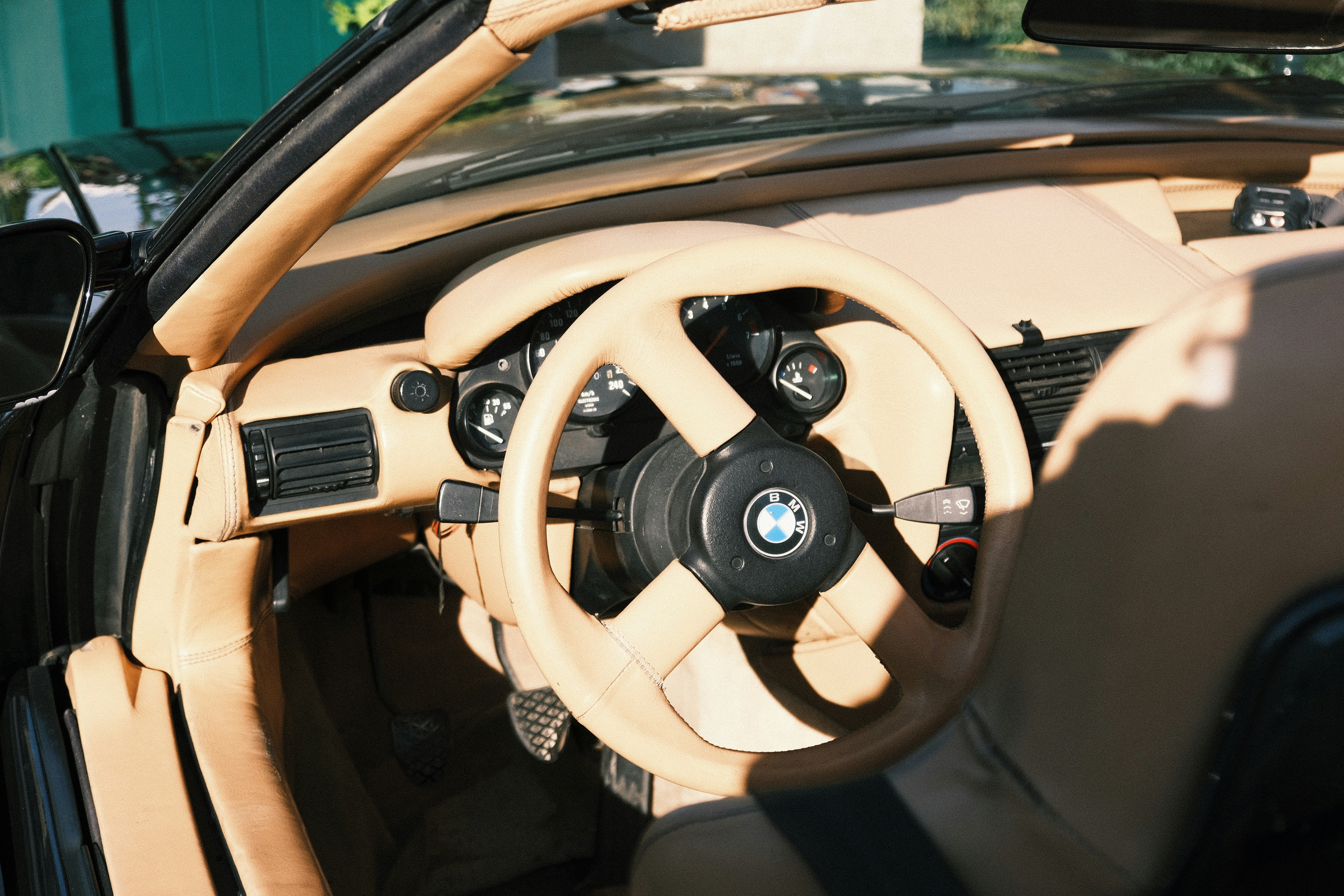 image of a car's interior showing the HomeLink buttons on the sun visor - garage door opener programming