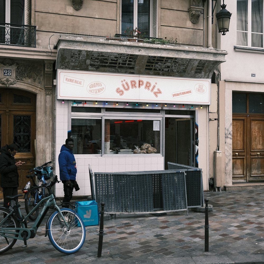 a store front with a bicycle parked in front