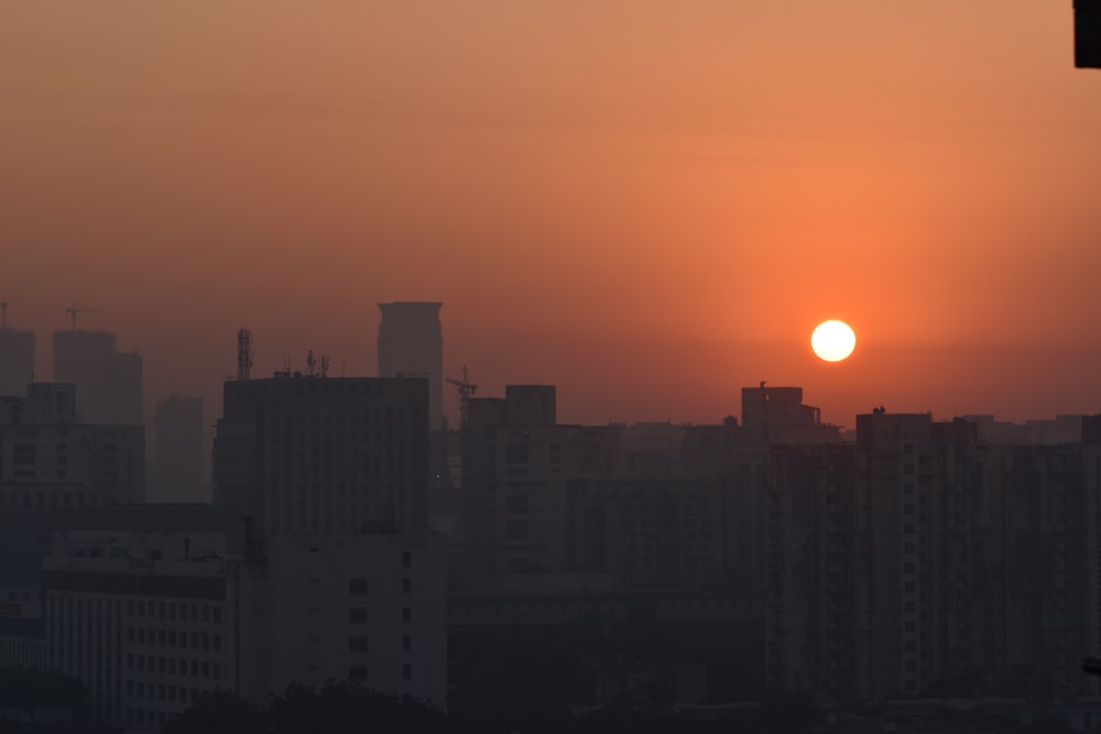 a city skyline at sunset