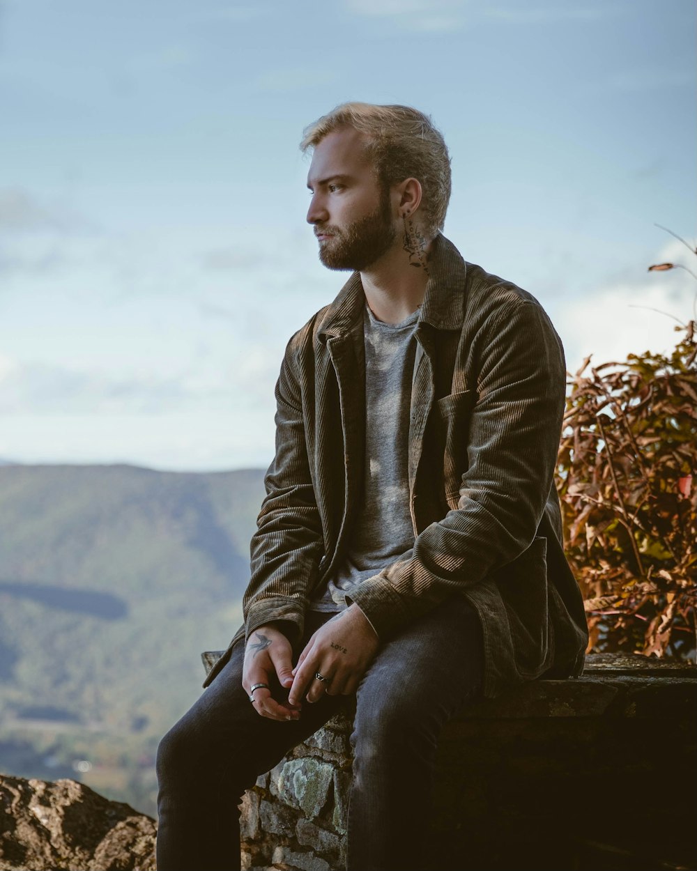 a person sitting on a rock